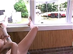 Nerdy naked chick sets up her camera and vibrates her pussy while the handyman watches.