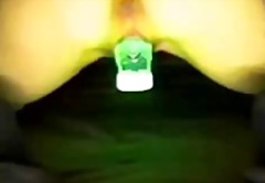 Hot chick masturbating with a glowing object in her pussy.